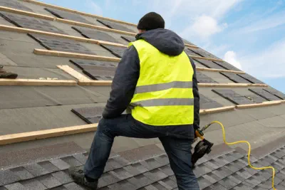 An experienced roof contractor is installing a new roof on a home.