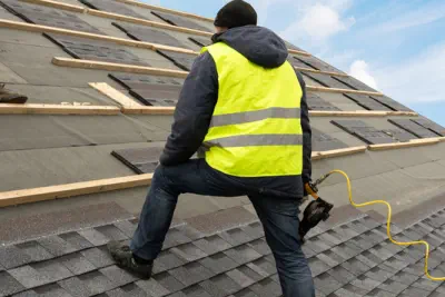 An experienced roof contractor is installing a new roof on a home.